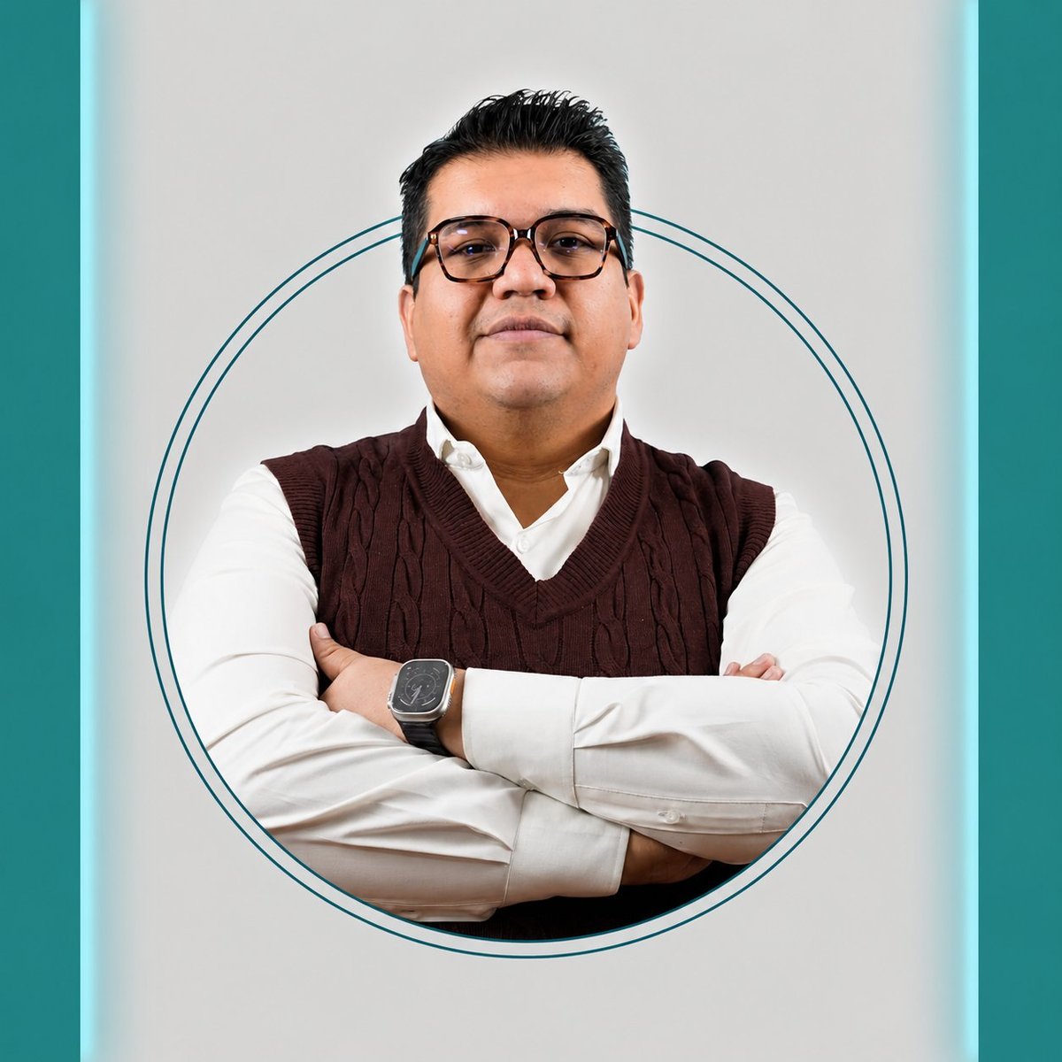 Professional headshot of a man wearing glasses, brown vest, and white shirt with arms crossed in a circular frame