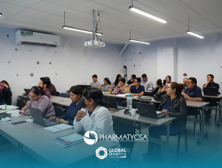 A classroom full of students sitting at desks with laptops during a Pharmaycsa and Global Business training session