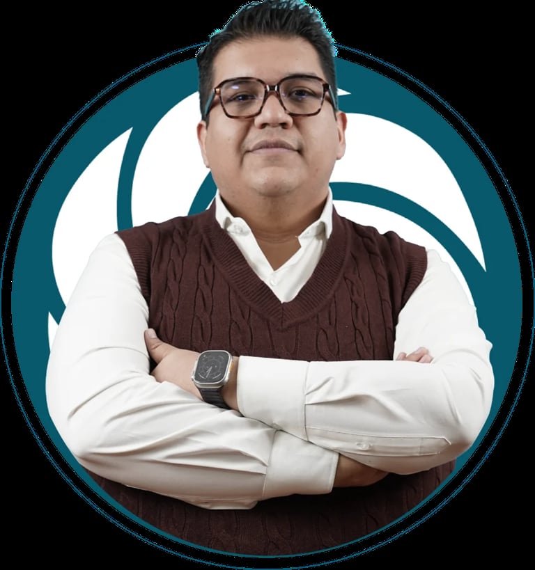 Professional headshot of a man with glasses wearing a white shirt and brown sweater vest, arms crossed, on a teal circular background